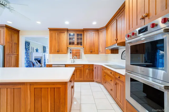 a kitchen with stainless steel appliances granite countertop a sink and a stove