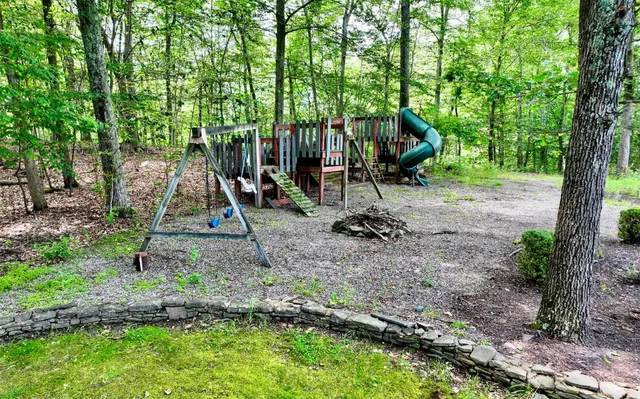 a view of a park with a slide