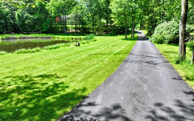 a view of swimming pool with a yard