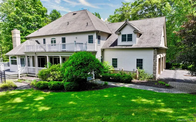 a view of a house with a yard and plants