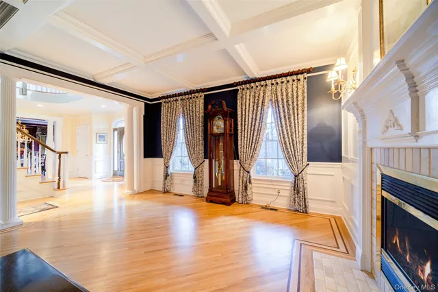 a view of an entryway with wooden floor and windows