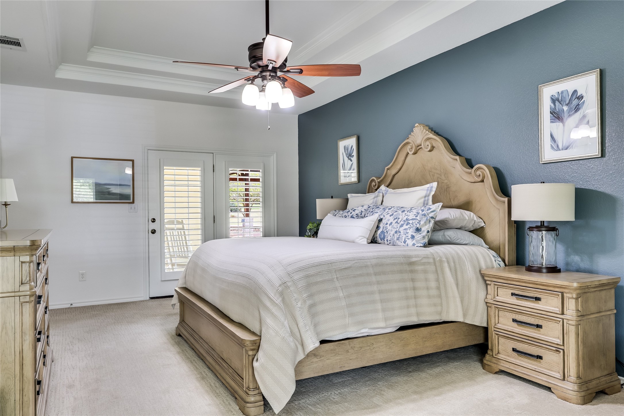906 Texas Trail Austin, TX 78737 - Photo 15 of 26 a bedroom with a bed and a chandelier