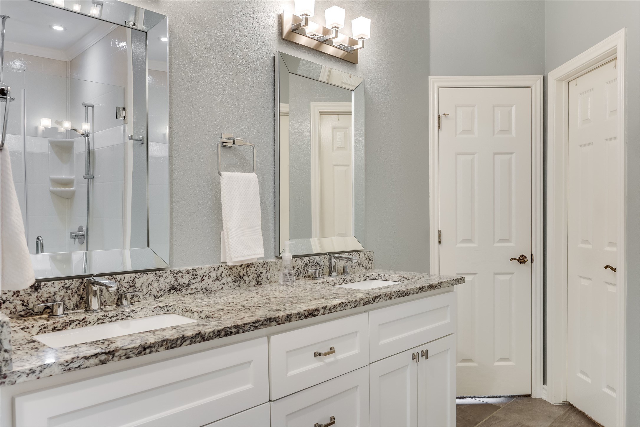 906 Texas Trail Austin, TX 78737 - Photo 18 of 26 a bathroom with a granite countertop sink and a mirror