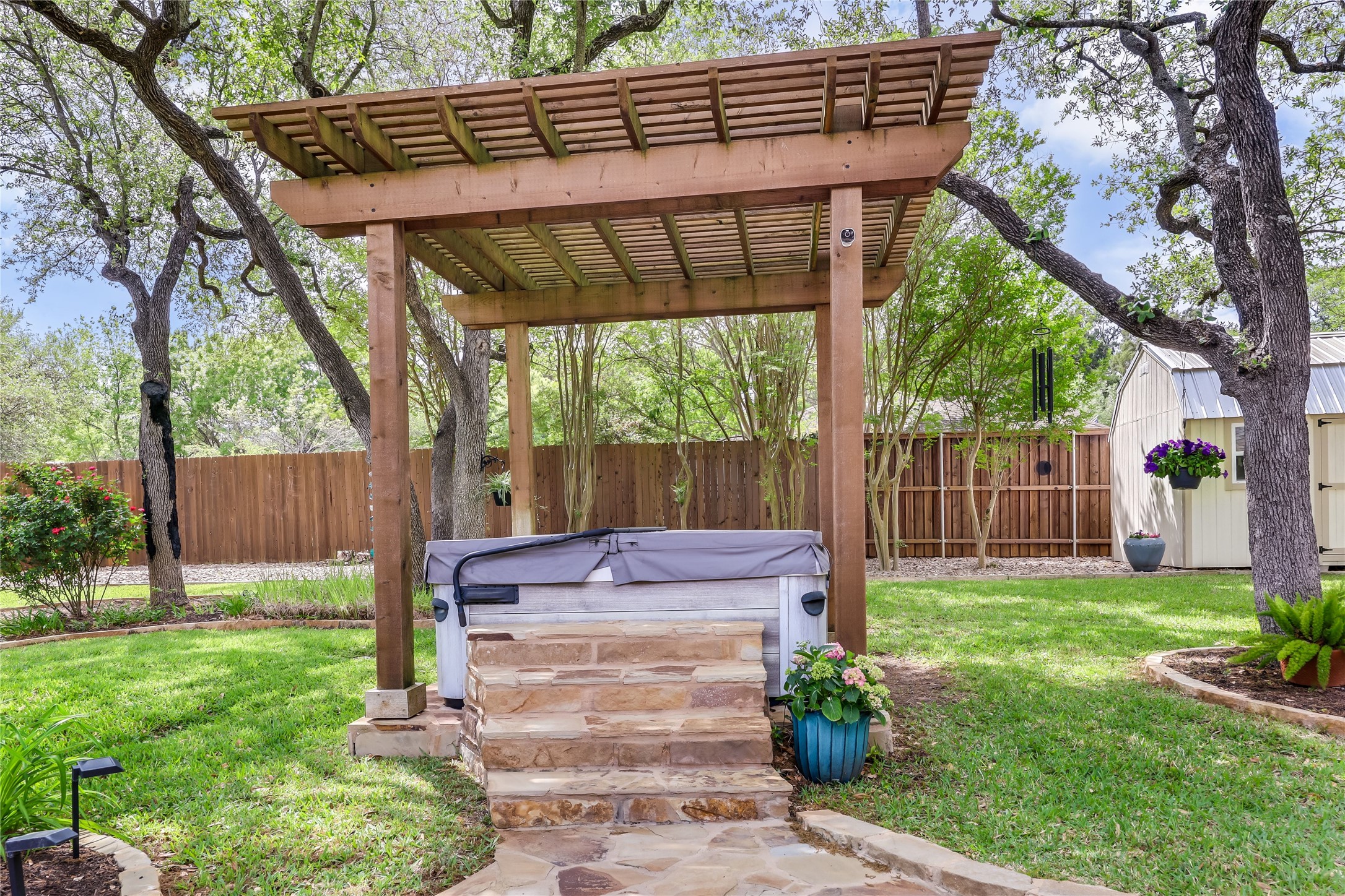 906 Texas Trail Austin, TX 78737 - Photo 22 of 26 a front view of a house with garden