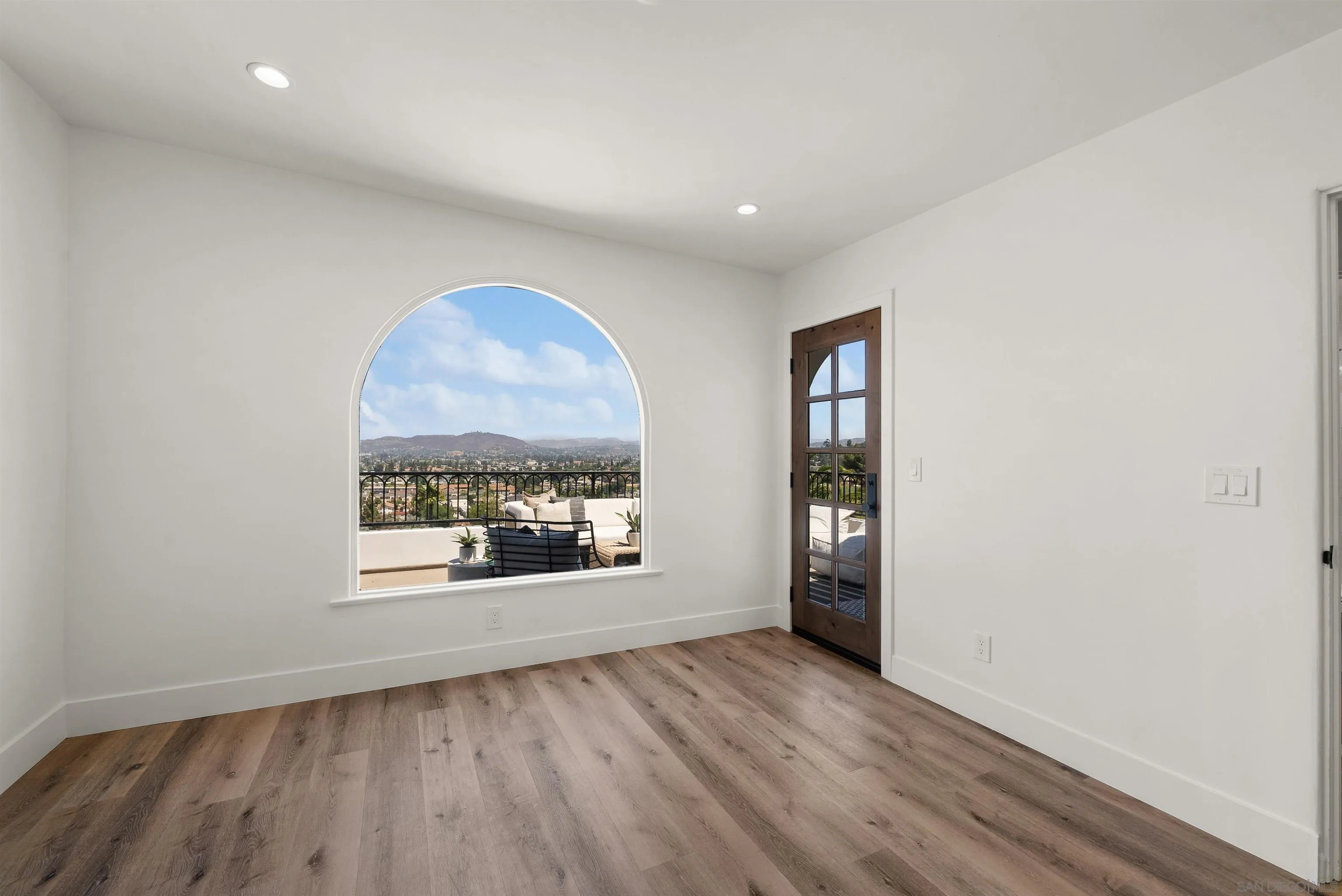 1262 Horizon Ridge El Cajon, CA 92020 - Photo 27 of 68 an empty room with wooden floor and windows