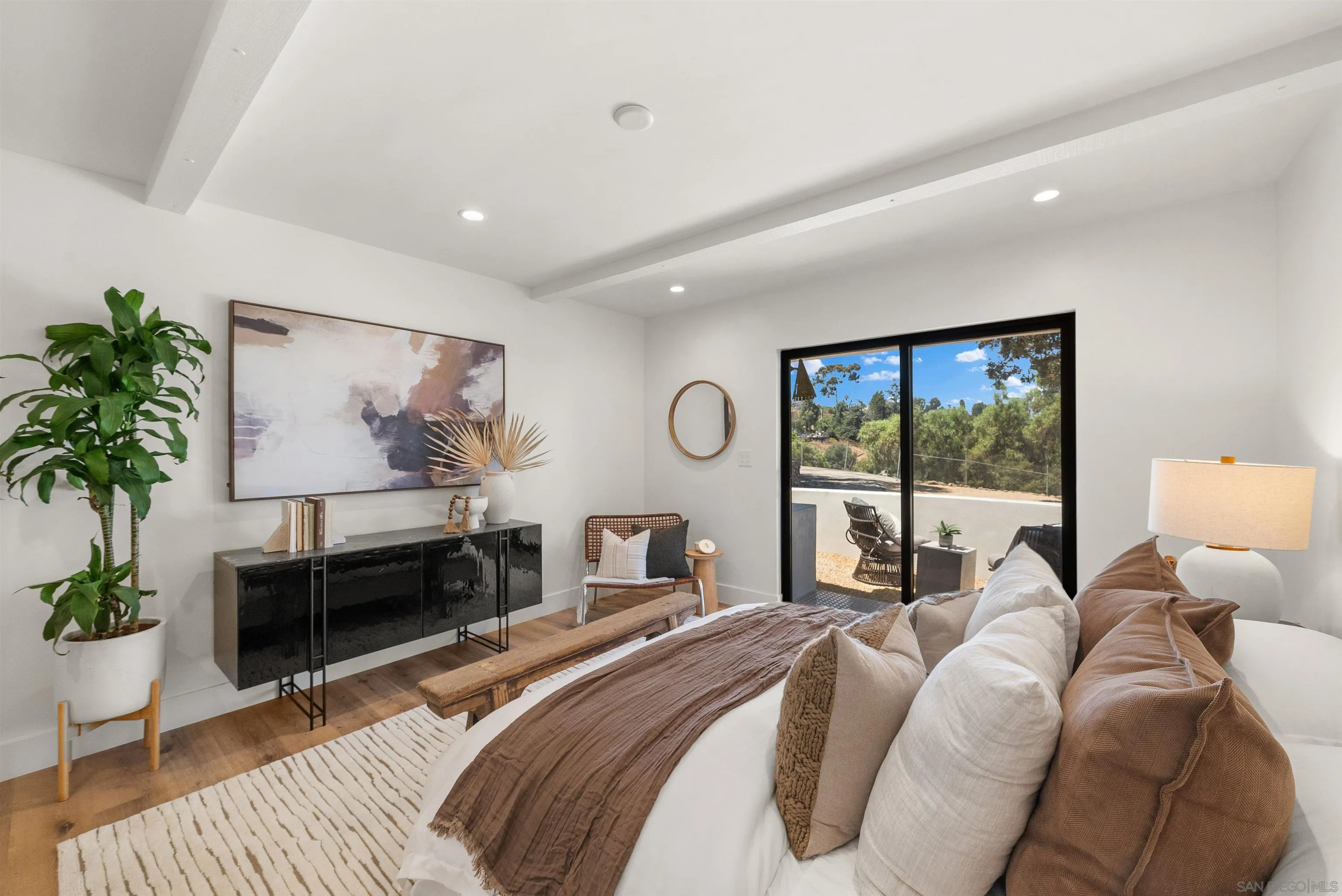 1262 Horizon Ridge El Cajon, CA 92020 - Photo 31 of 68 a bedroom with a bed a table and a large window