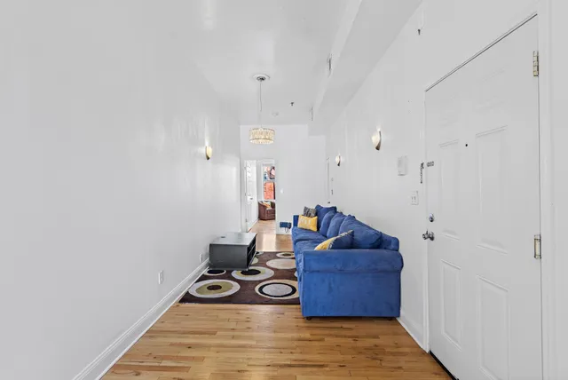 a living room with furniture and a rug