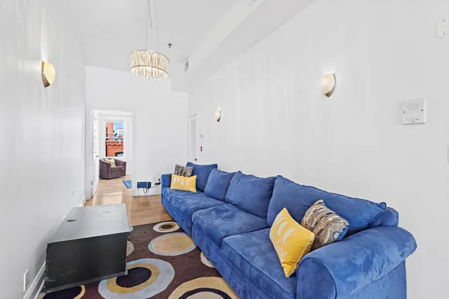 a living room with furniture and a rug