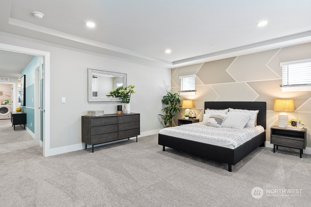 22829 20th Place West Bothell, WA 98021 - Photo 20 of 31 a spacious bedroom with a bed and a lamp