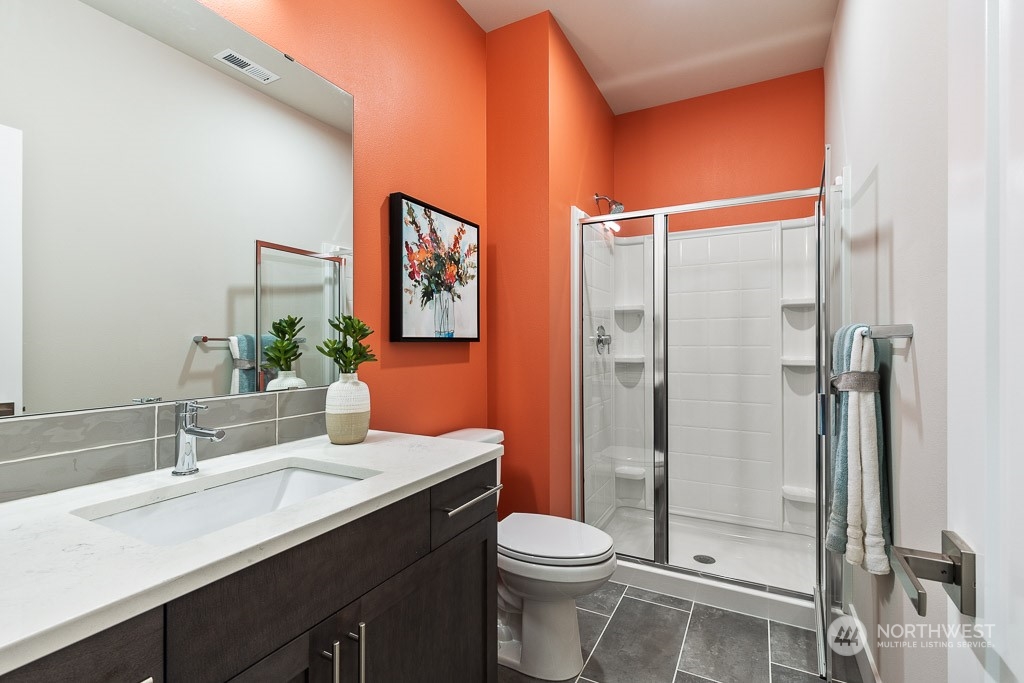 22829 20th Place West Bothell, WA 98021 - Photo 8 of 31 a bathroom with a toilet a sink and shower