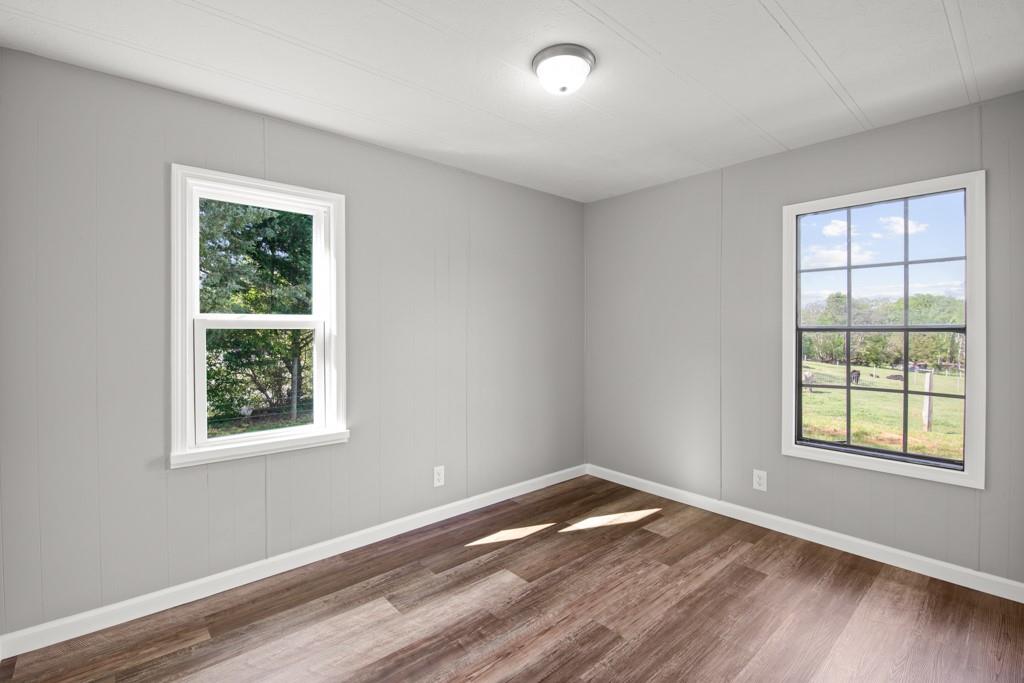710 Athens Road Lexington, GA 30648 - Photo 16 of 17 a view of a room with wooden floor and window