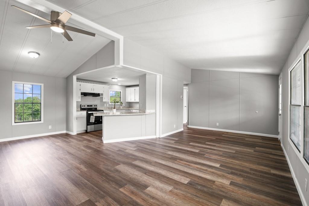 710 Athens Road Lexington, GA 30648 - Photo 3 of 17 a view of kitchen and hall with wooden floor