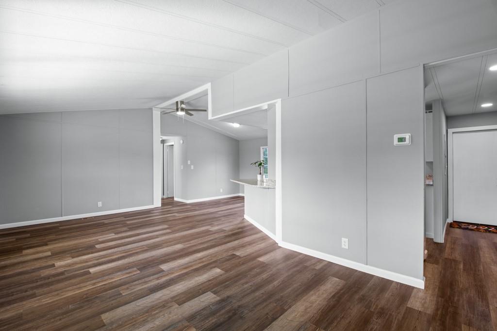 710 Athens Road Lexington, GA 30648 - Photo 6 of 17 a view of a room with wooden floor and a bathroom