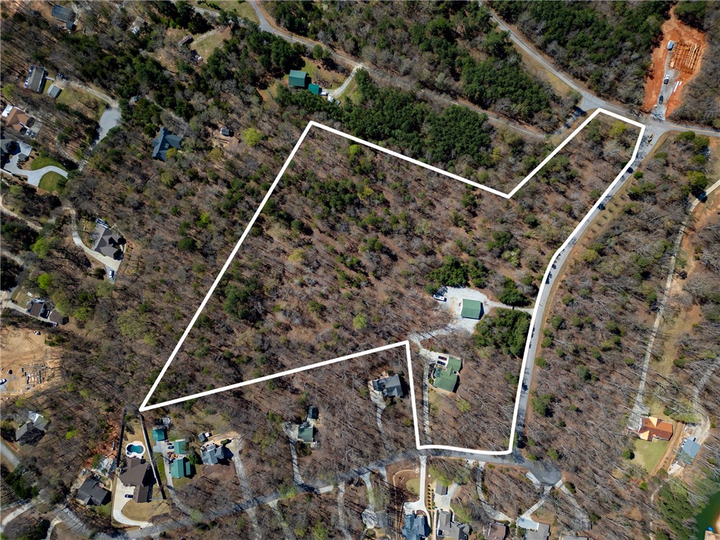 204 Riverlake Road Fair Play, SC 29643 - Photo 46 of 50 This expansive lot offers ample space, surrounded by lush trees, perfect for building your dream home.