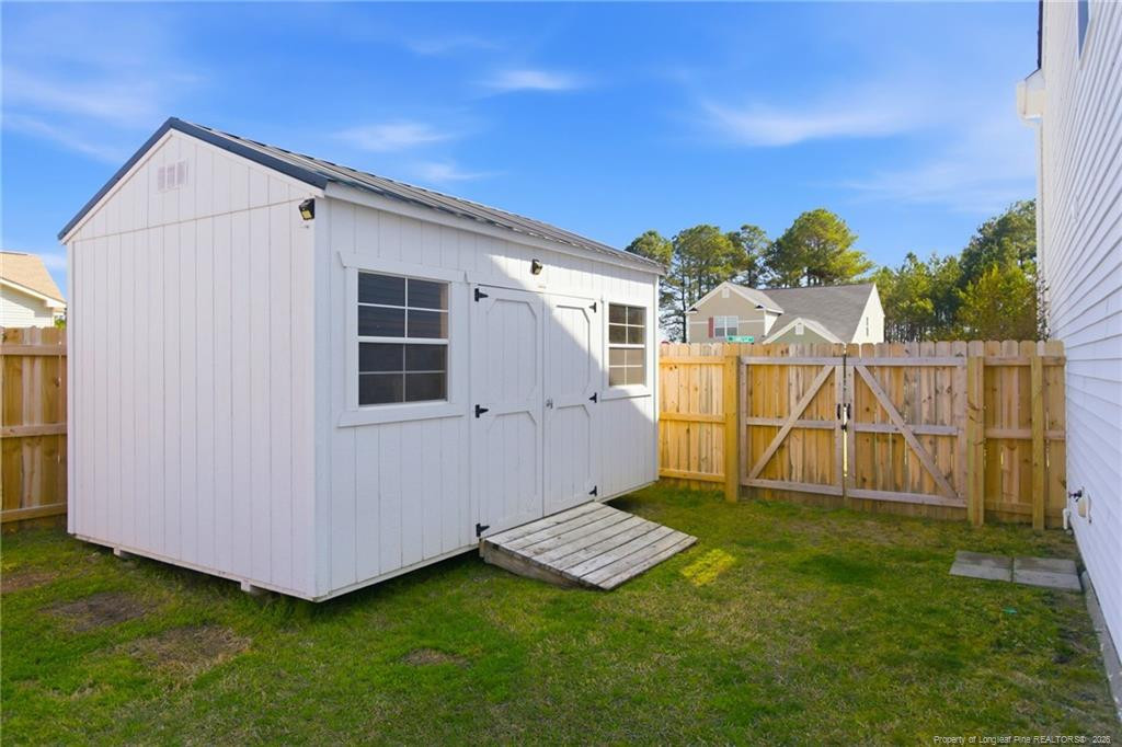 334 Crane Way Bunnlevel, NC 28323 - Photo 39 of 45 a view of a backyard with a house