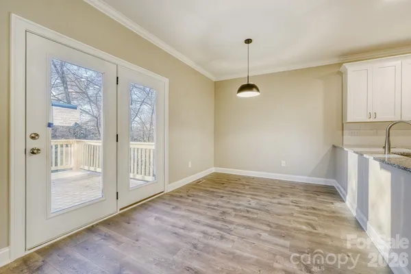 a view of a kitchen with a sink and a window