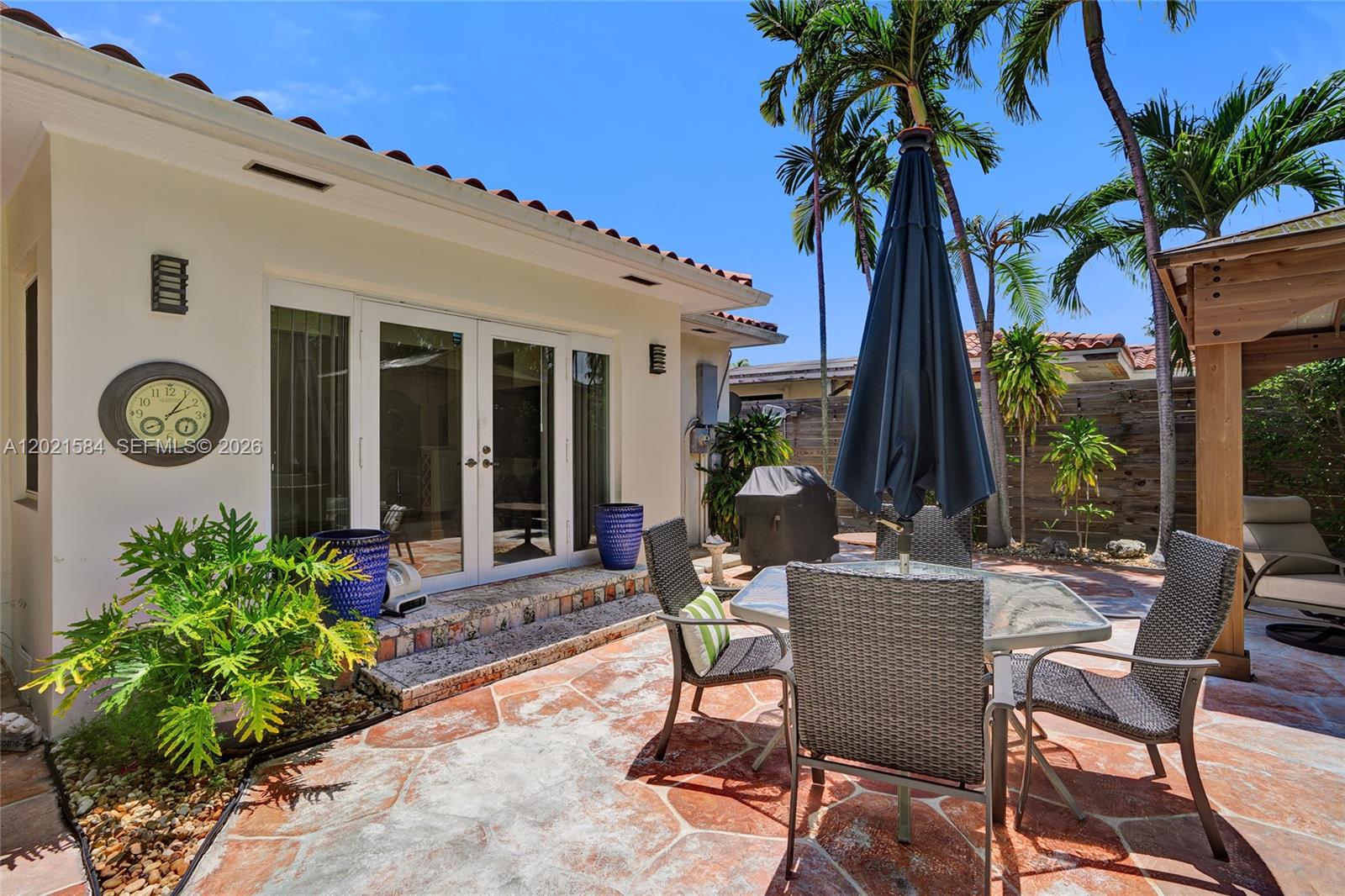 811 Northeast 73rd Street Miami, FL 33138 - Photo 26 of 51 a view of a house with backyard and sitting area
