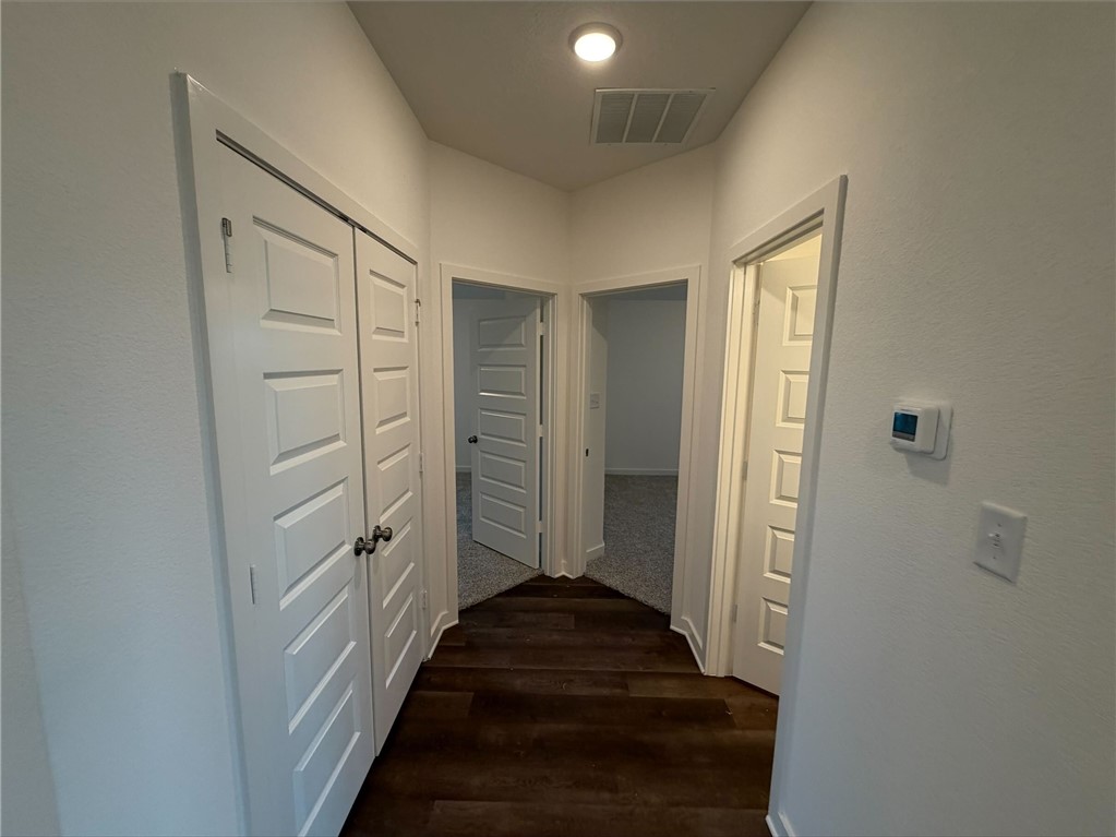 222 Cross Lane Caldwell, TX 77836 - Photo 6 of 13 a view of a hallway with wooden floor and closet area