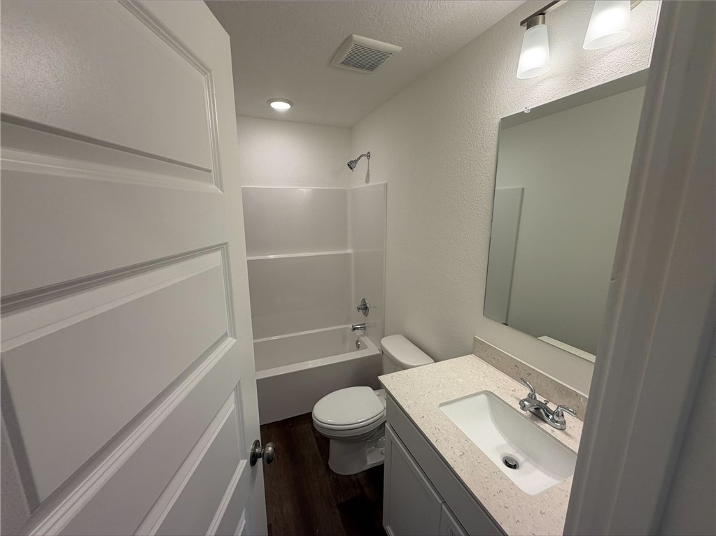 222 Cross Lane Caldwell, TX 77836 - Photo 7 of 13 a bathroom with a sink a toilet and a shower
