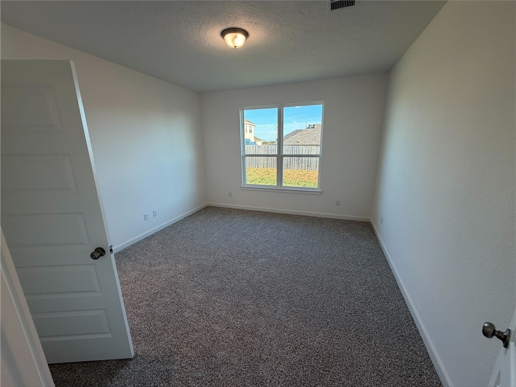 222 Cross Lane Caldwell, TX 77836 - Photo 9 of 13 an empty room with a window