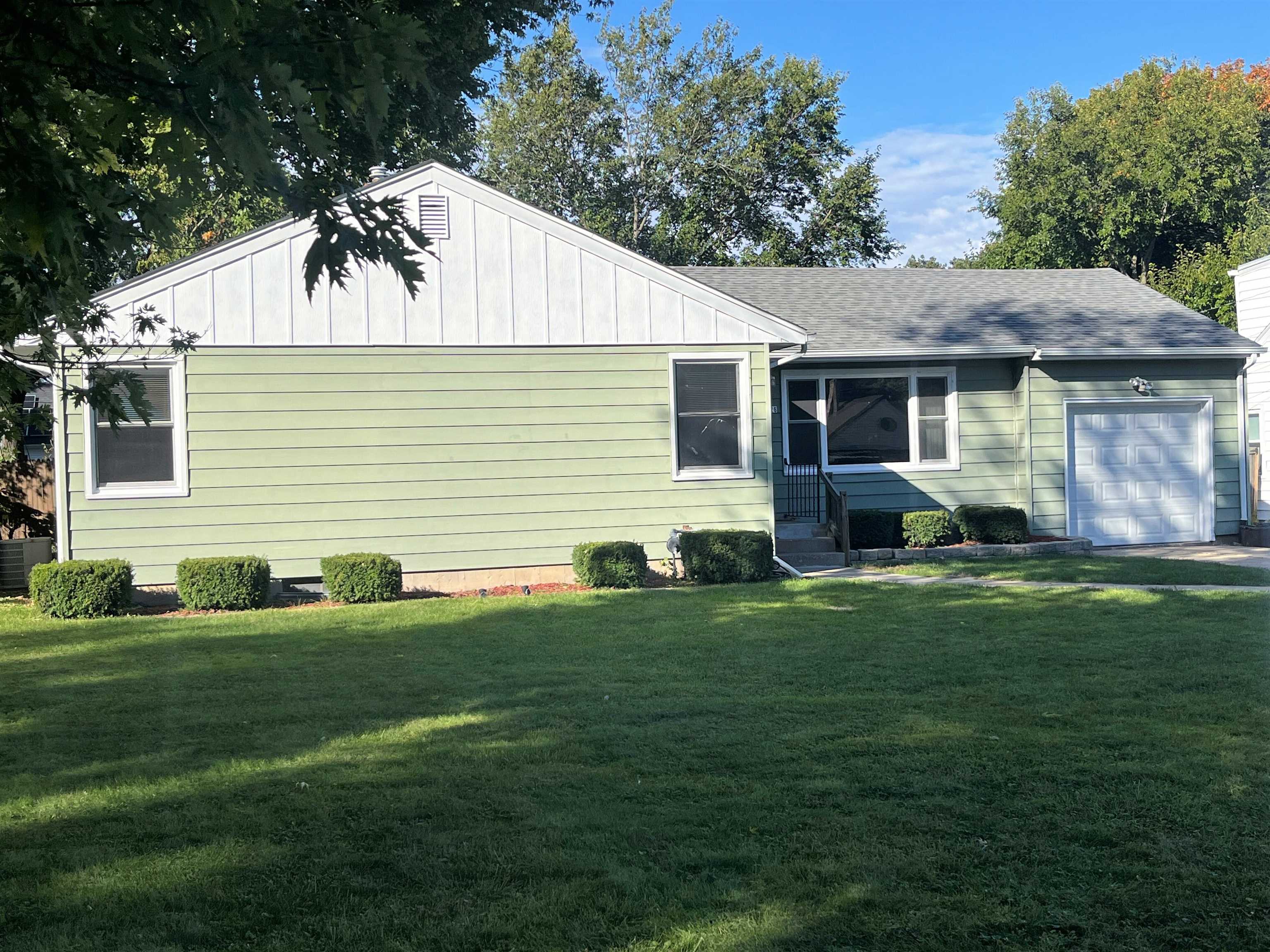 4026 Pinecrest Road Rockford, IL 61107 - Photo 1 of 27 a front view of house with yard and green space
