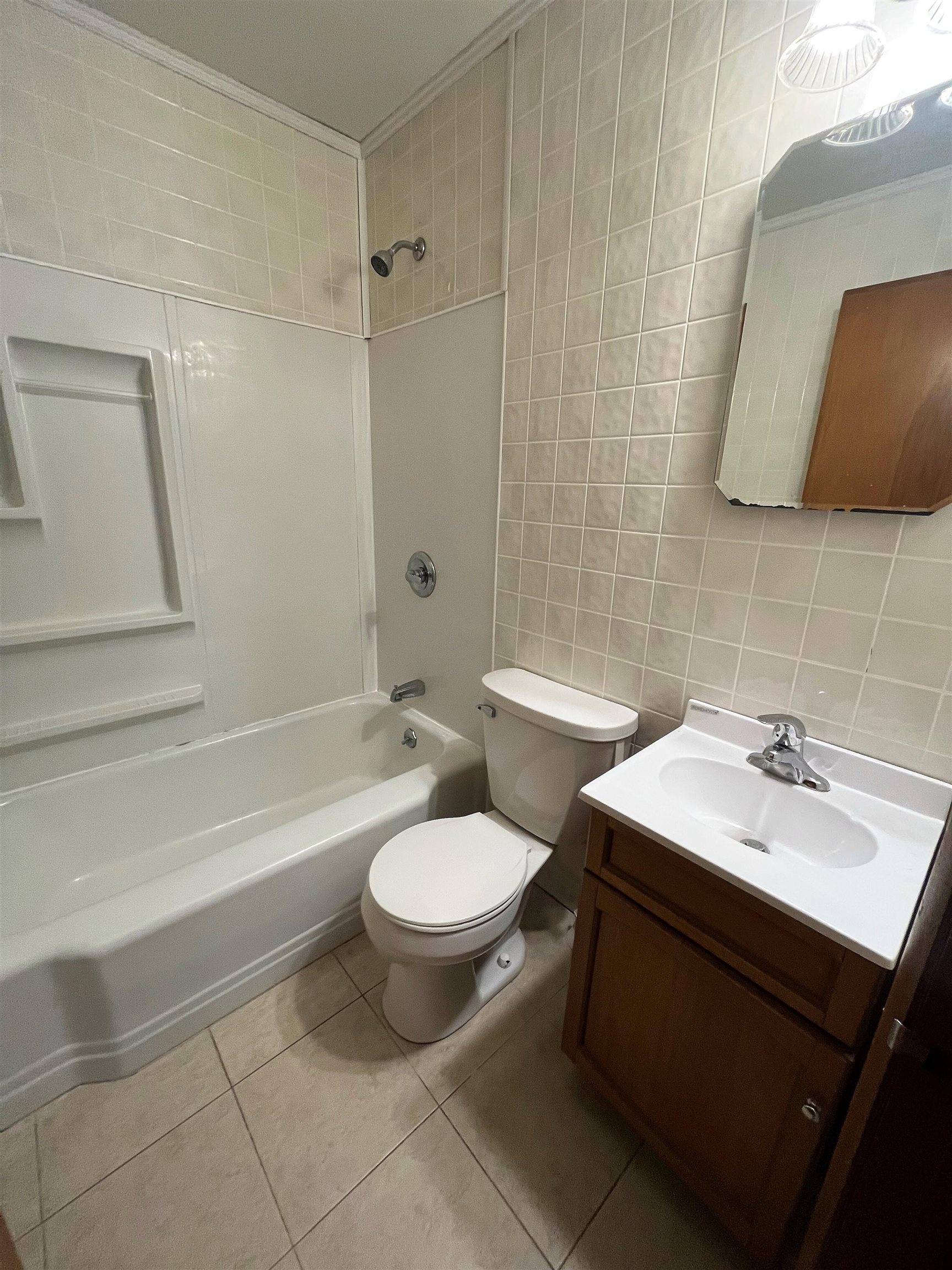 4026 Pinecrest Road Rockford, IL 61107 - Photo 11 of 27 a bathroom with a sink toilet and shower