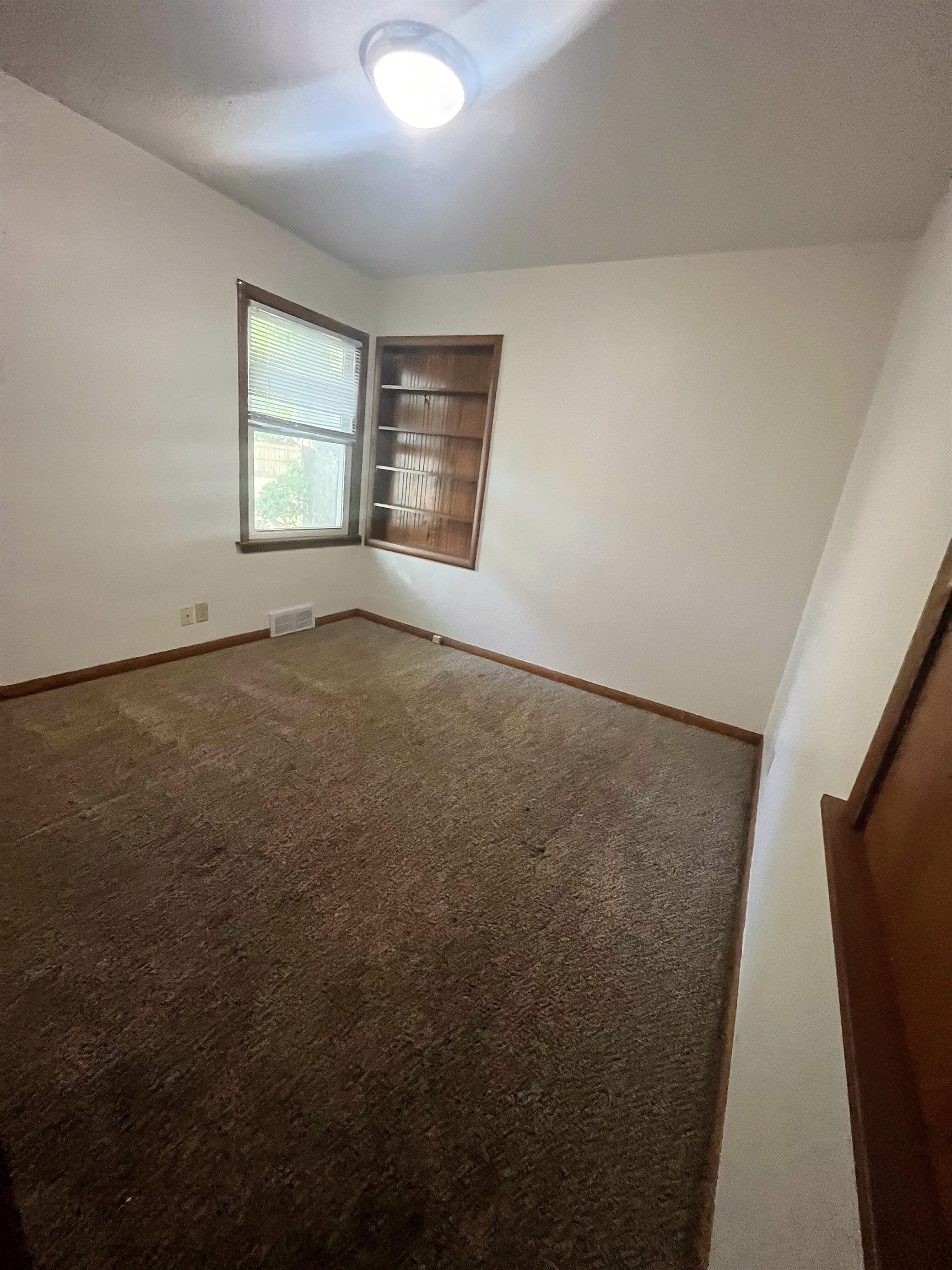 4026 Pinecrest Road Rockford, IL 61107 - Photo 15 of 27 an empty room with windows