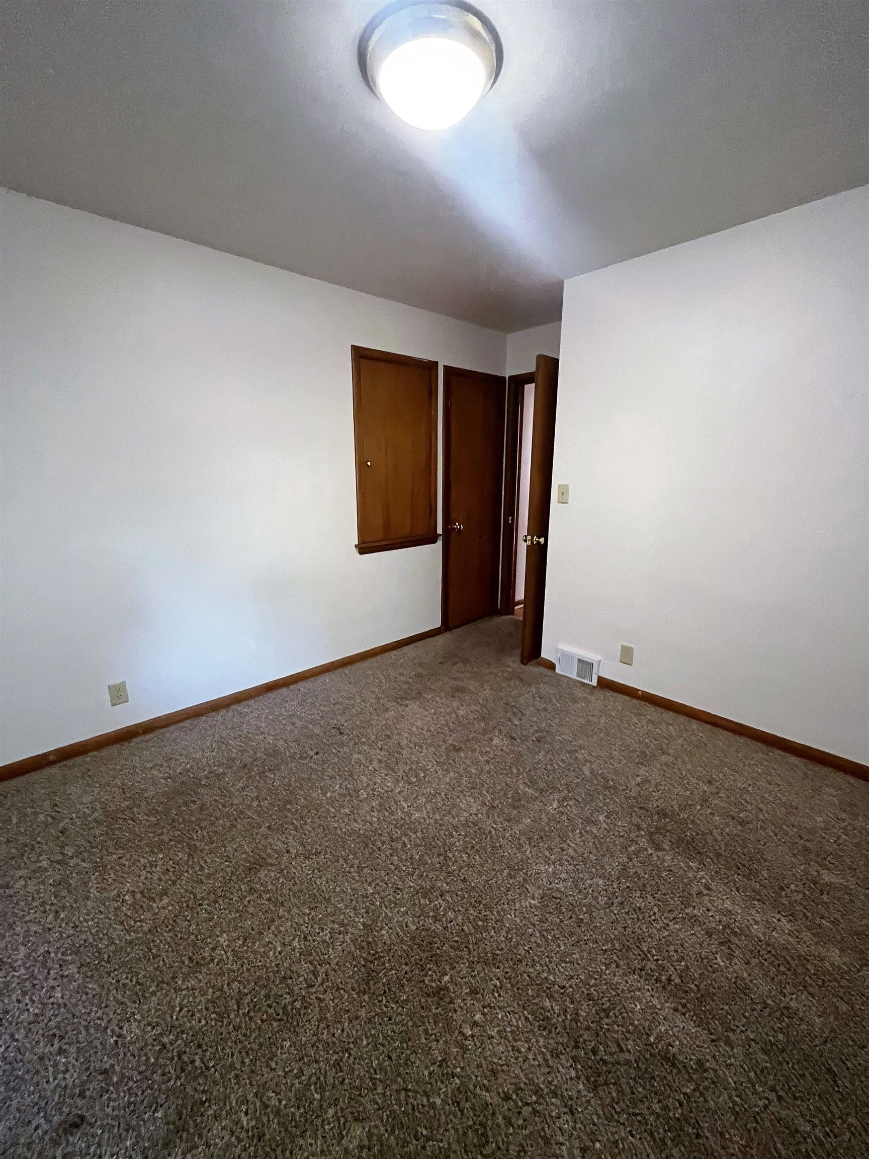 4026 Pinecrest Road Rockford, IL 61107 - Photo 16 of 27 an empty room with a natural light