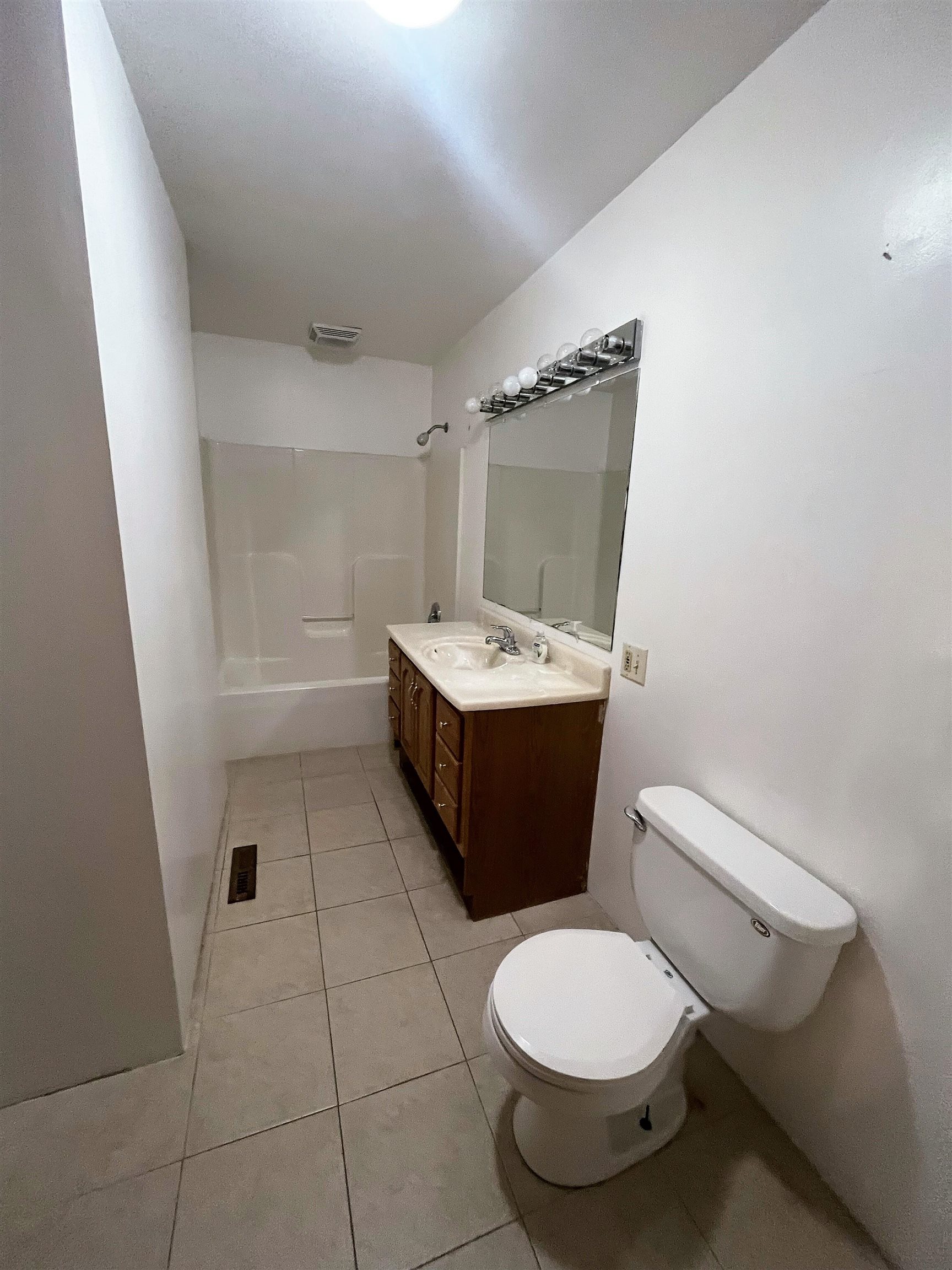 4026 Pinecrest Road Rockford, IL 61107 - Photo 17 of 27 a bathroom with a sink a toilet and mirror