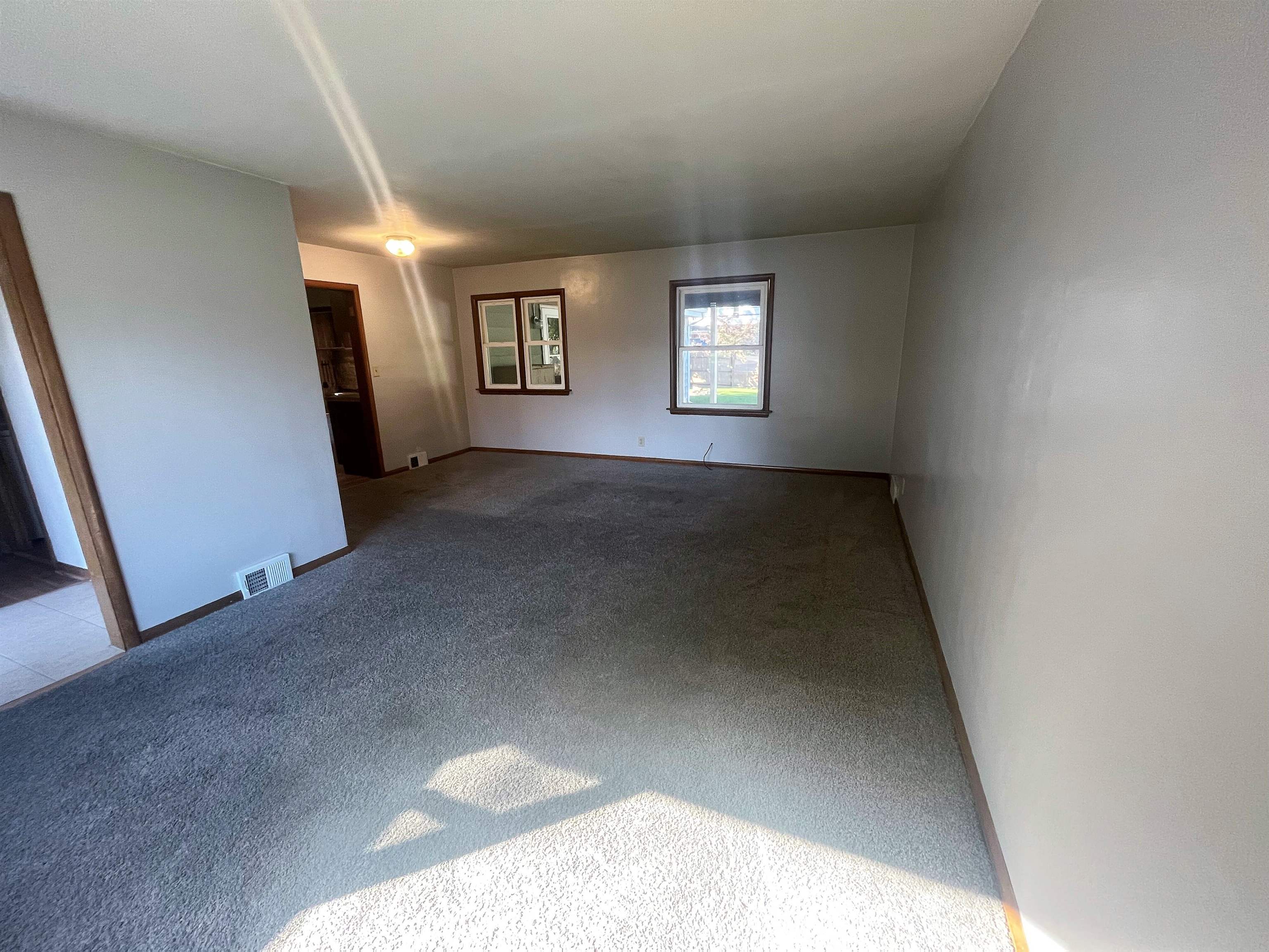 4026 Pinecrest Road Rockford, IL 61107 - Photo 3 of 27 an empty room with windows