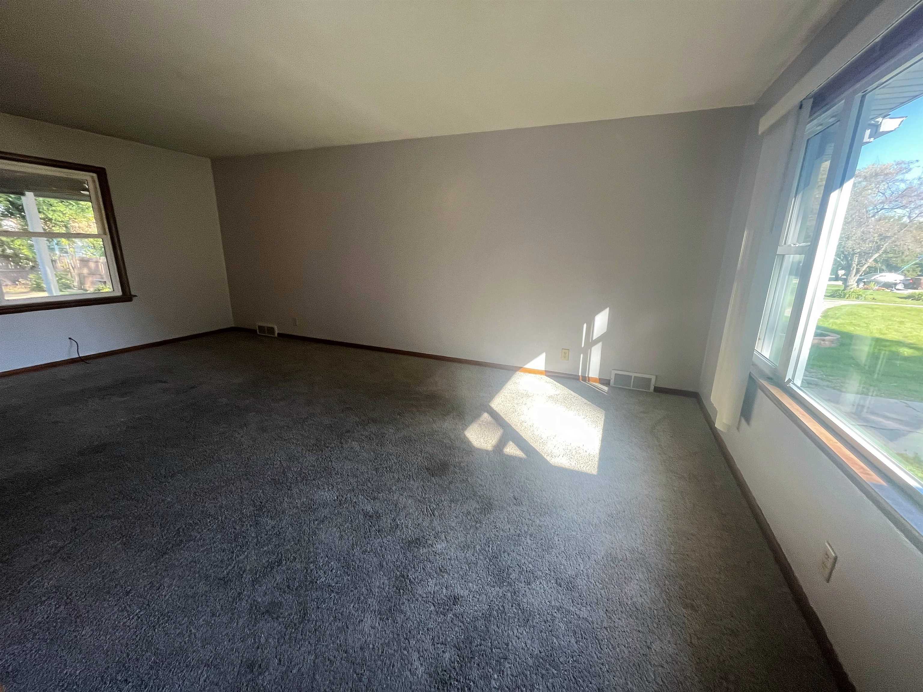 4026 Pinecrest Road Rockford, IL 61107 - Photo 4 of 27 an empty room with windows
