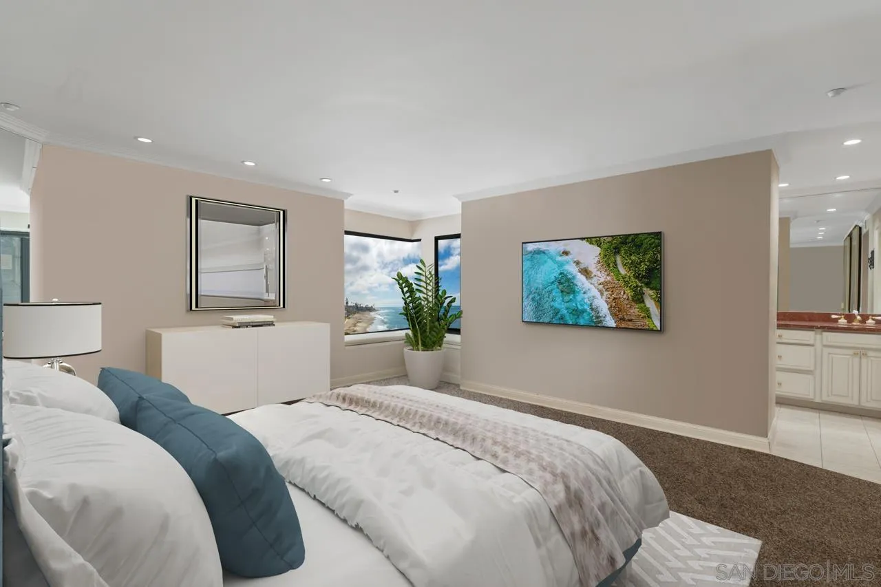100 Coast Boulevard, Unit 308 La Jolla, CA 92037 - Photo 11 of 40 a bedroom with a bed and a painting on the wall