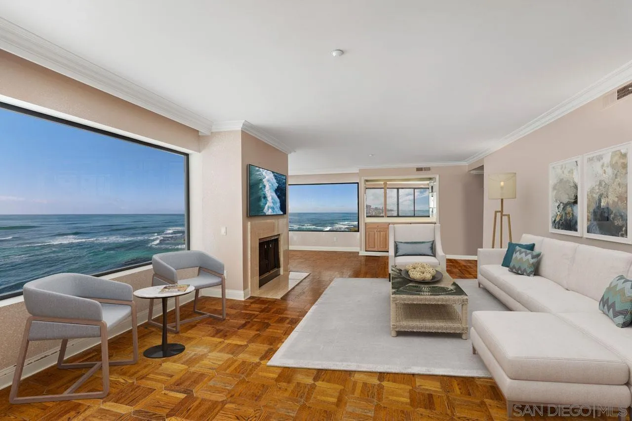 100 Coast Boulevard, Unit 308 La Jolla, CA 92037 - Photo 3 of 40 a living room with fireplace furniture and a floor to ceiling window