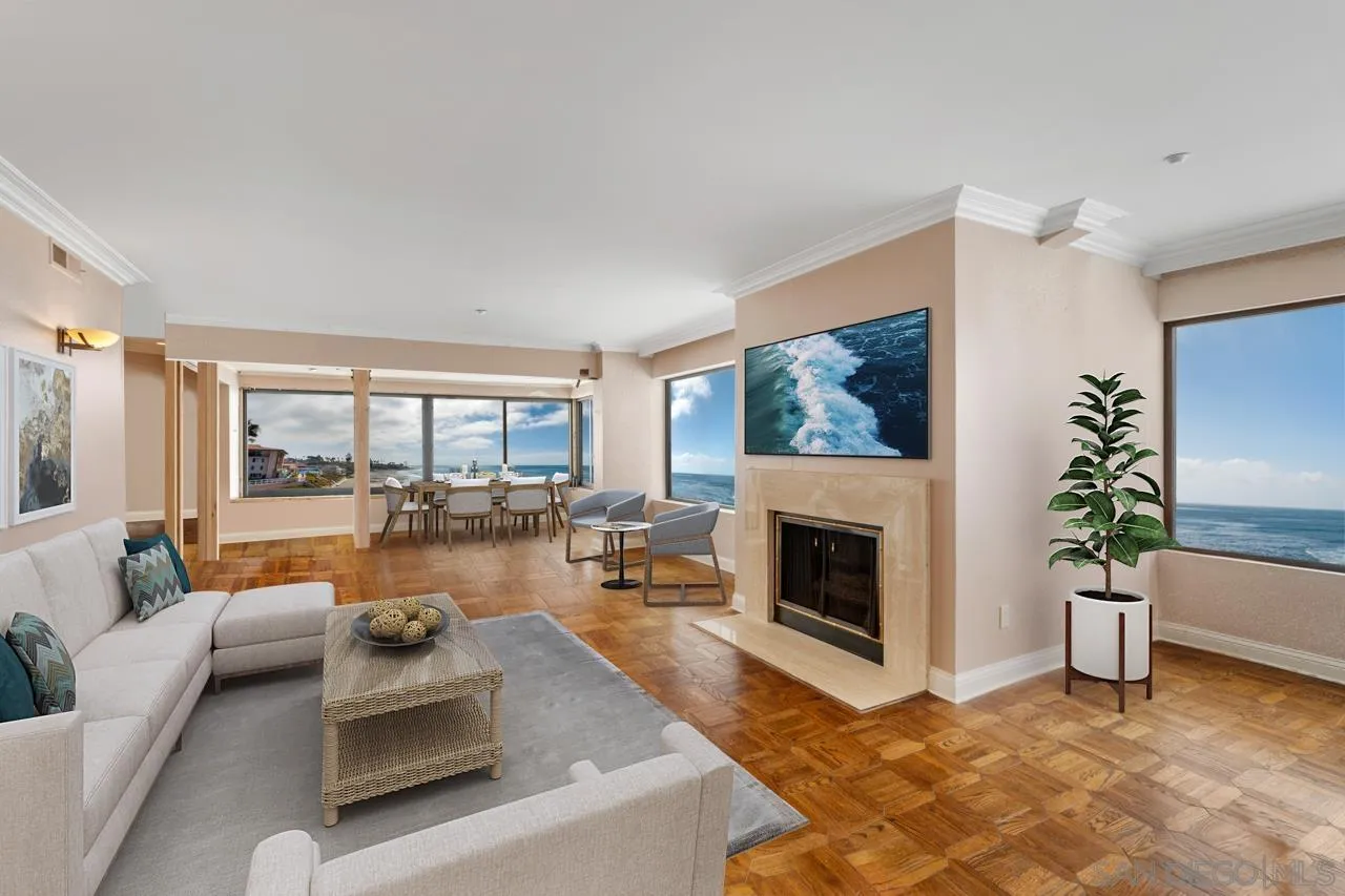 100 Coast Boulevard, Unit 308 La Jolla, CA 92037 - Photo 5 of 40 a living room with furniture large window and a fireplace