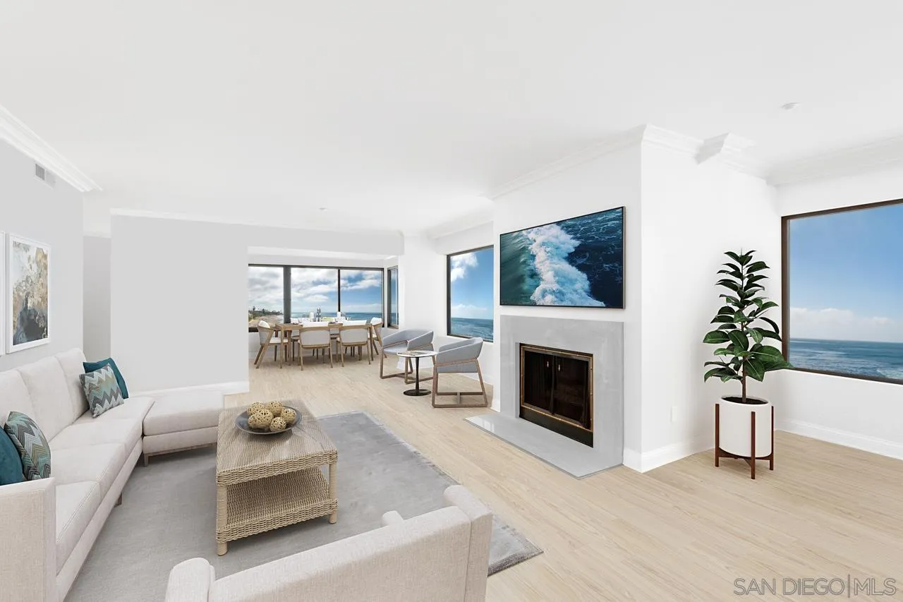 100 Coast Boulevard, Unit 308 La Jolla, CA 92037 - Photo 6 of 40 a living room with furniture and a fireplace
