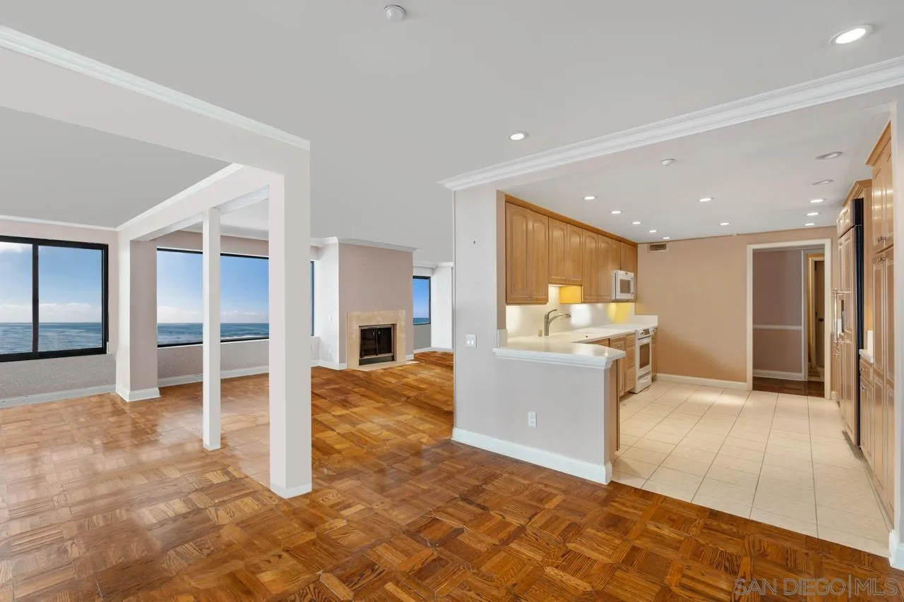100 Coast Boulevard, Unit 308 La Jolla, CA 92037 - Photo 7 of 40 a view of a living room kitchen and a sink