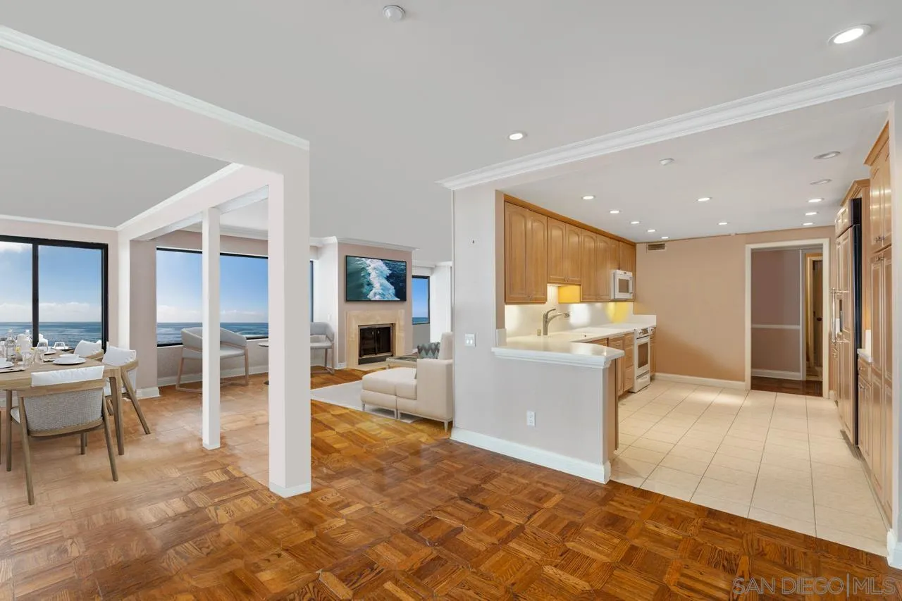 100 Coast Boulevard, Unit 308 La Jolla, CA 92037 - Photo 8 of 40 a living room with furniture a dining table and kitchen view