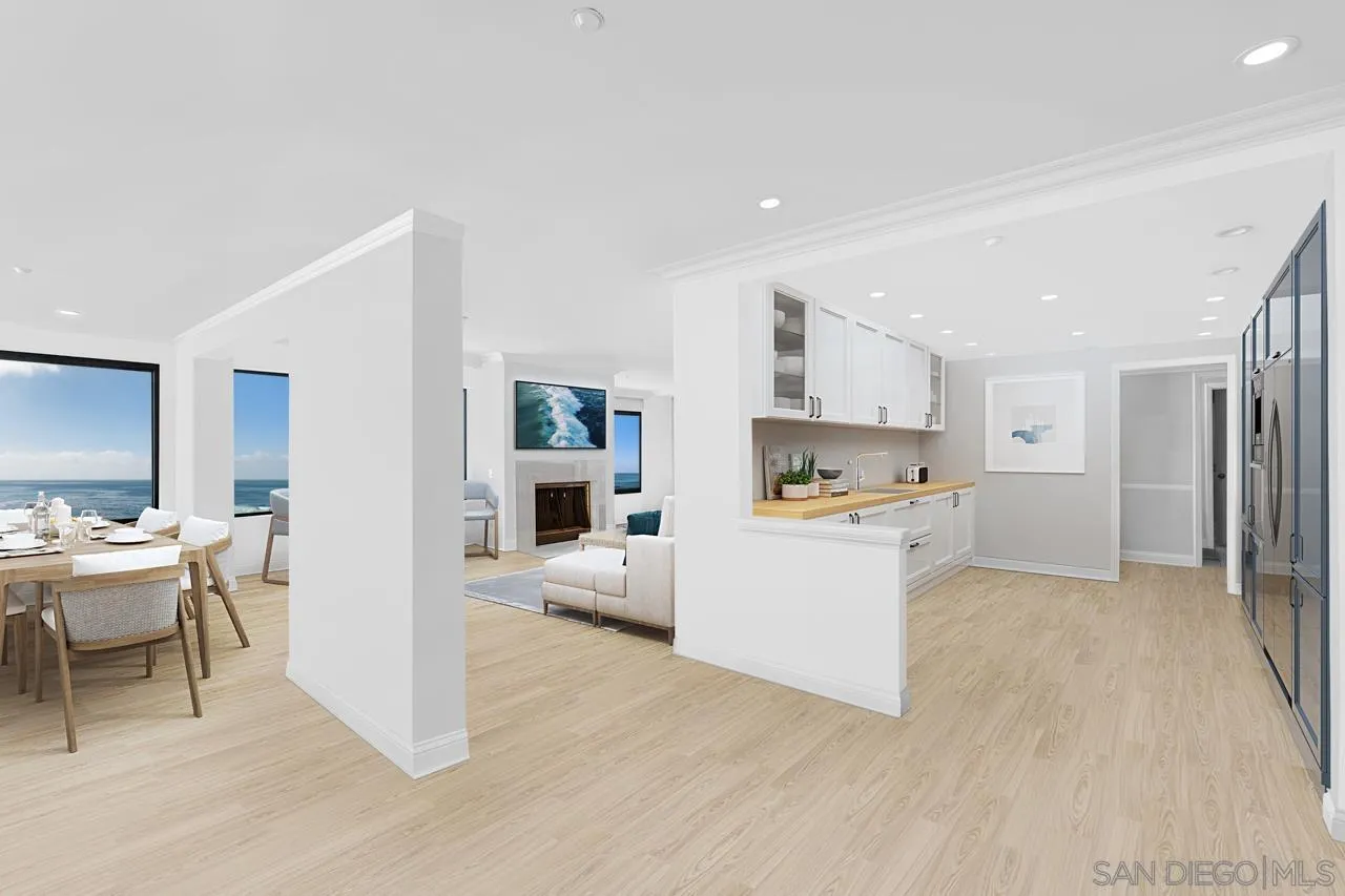 100 Coast Boulevard, Unit 308 La Jolla, CA 92037 - Photo 9 of 40 a view of kitchen with refrigerator stove and wooden floor