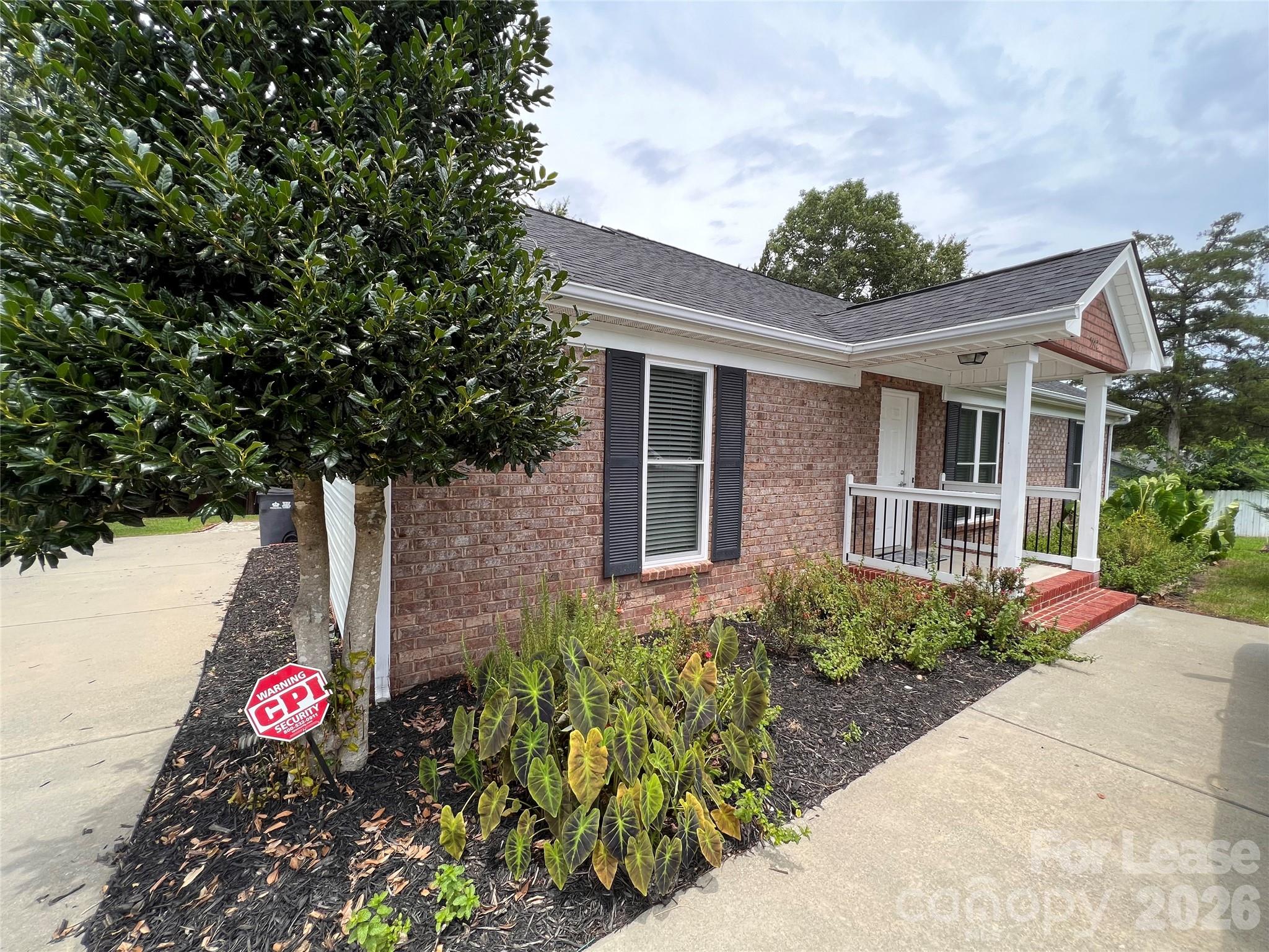 5312 Rea Road Charlotte, NC 28226 - Photo 3 of 34 a front view of a house with a yard