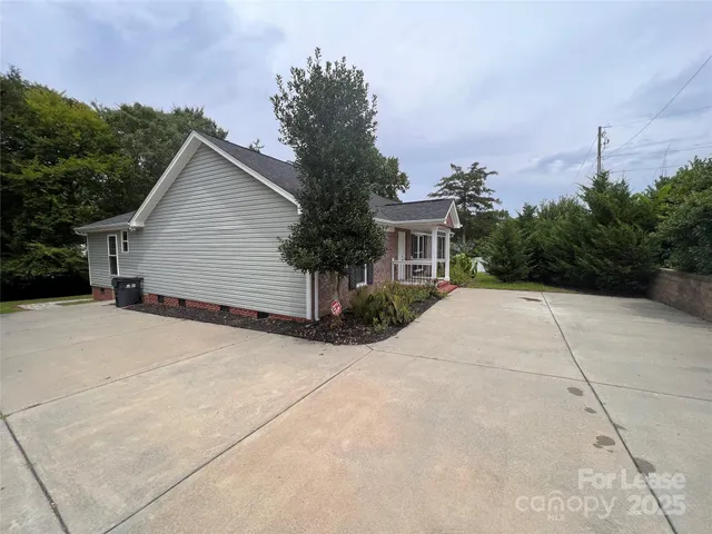 a view of house and outdoor space with yard