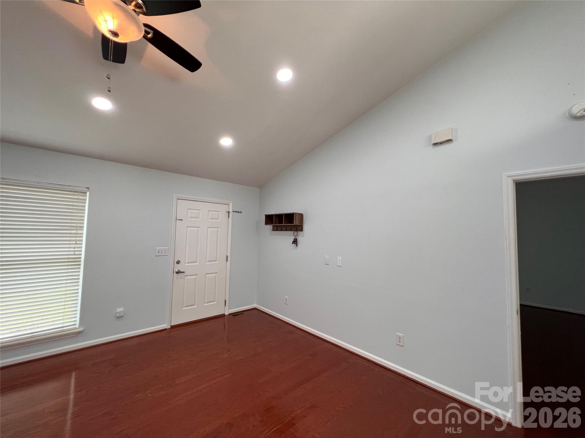 5312 Rea Road Charlotte, NC 28226 - Photo 6 of 34 an empty room with a ceiling fan and window
