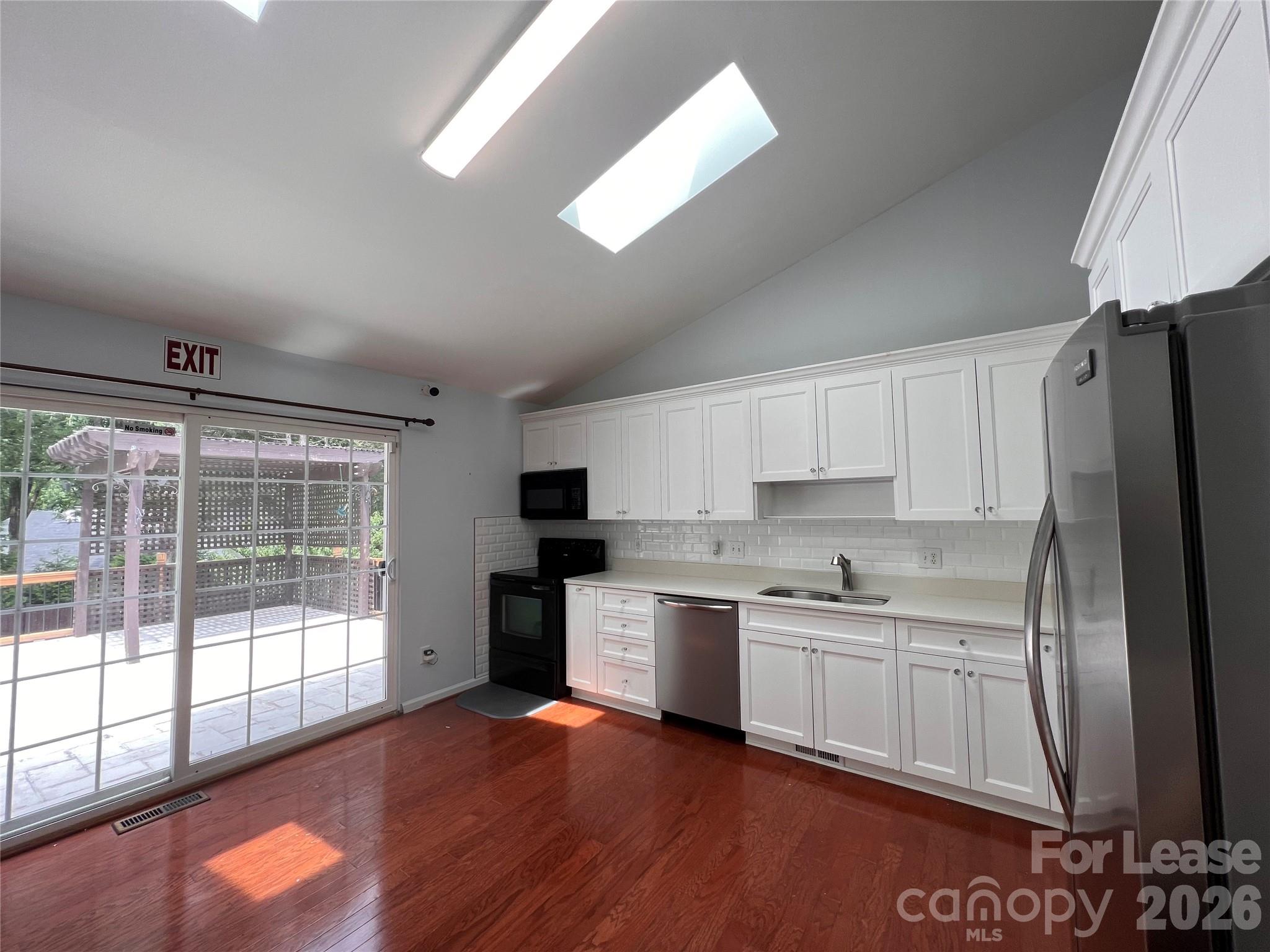 5312 Rea Road Charlotte, NC 28226 - Photo 8 of 34 a kitchen with a sink a stove and cabinets