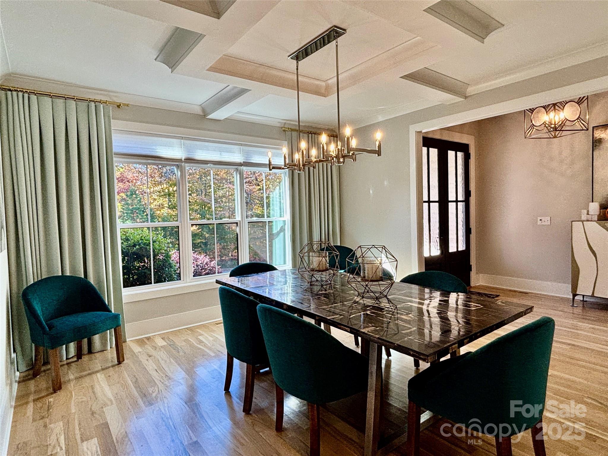 108 41st Avenue Northwest Hickory, NC 28601 - Photo 12 of 48 a dining room with furniture a chandelier and wooden floor
