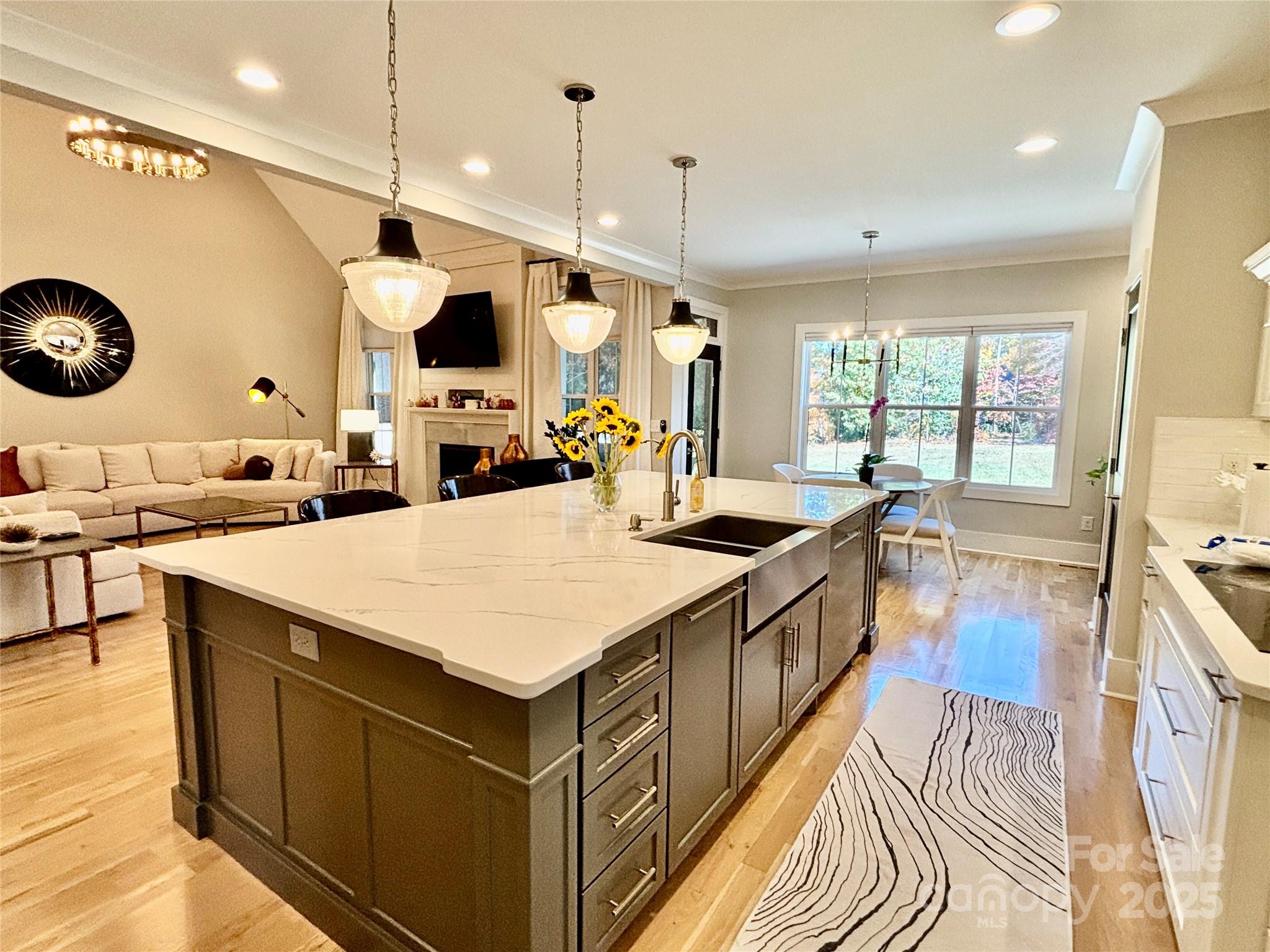 108 41st Avenue Northwest Hickory, NC 28601 - Photo 13 of 48 a large kitchen with a large counter top a sink a stove and a window