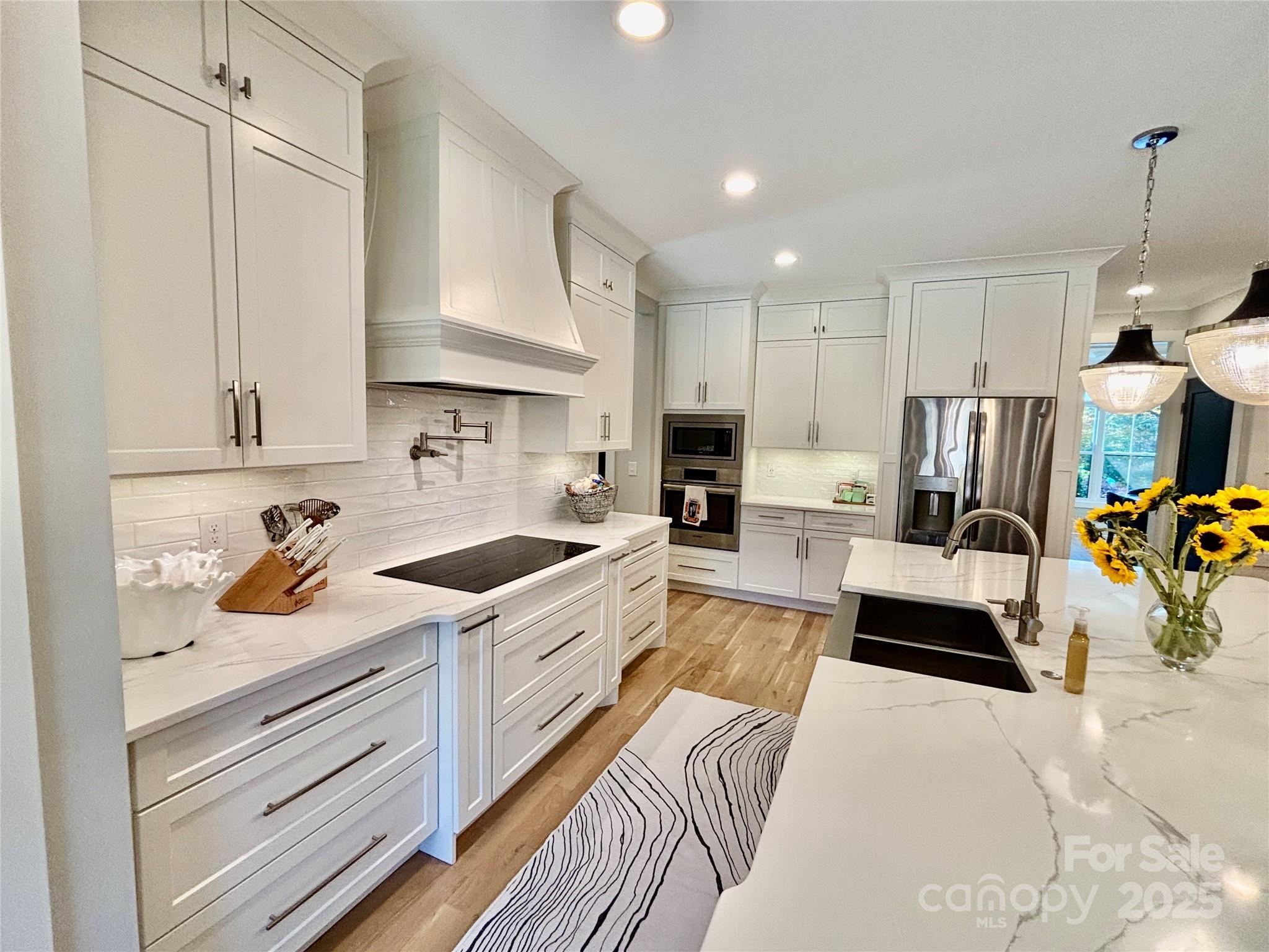 108 41st Avenue Northwest Hickory, NC 28601 - Photo 15 of 48 a kitchen with stainless steel appliances granite countertop a stove a sink and a refrigerator