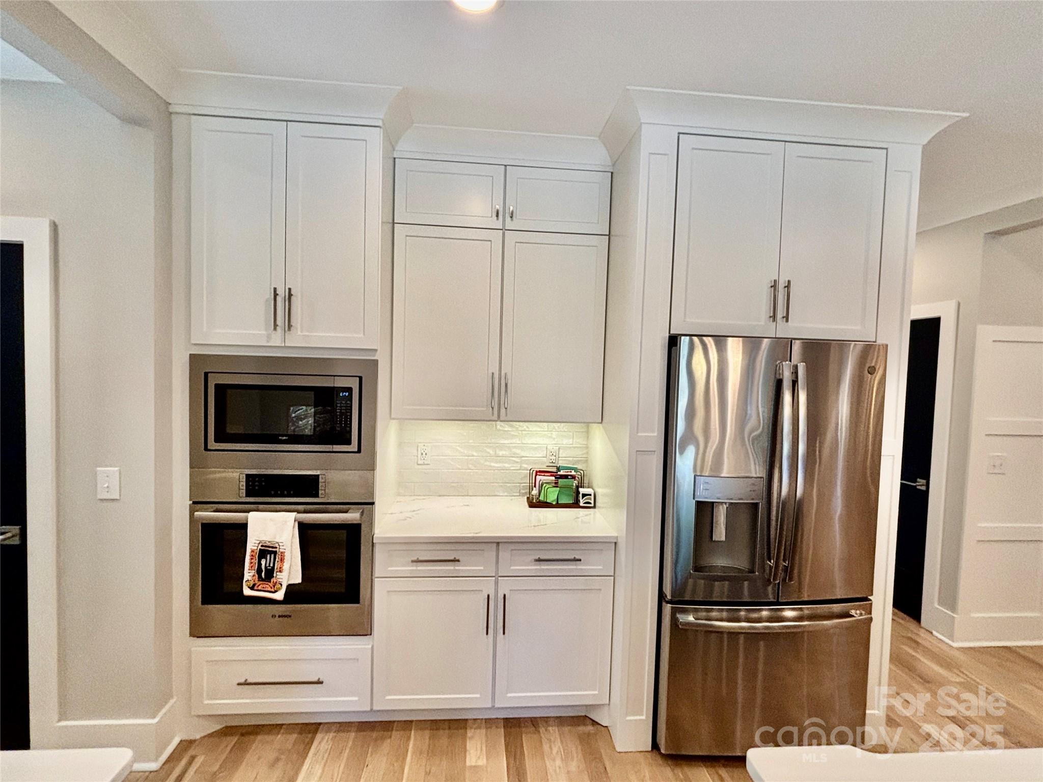 108 41st Avenue Northwest Hickory, NC 28601 - Photo 16 of 48 a kitchen with granite countertop a refrigerator and a stove top oven