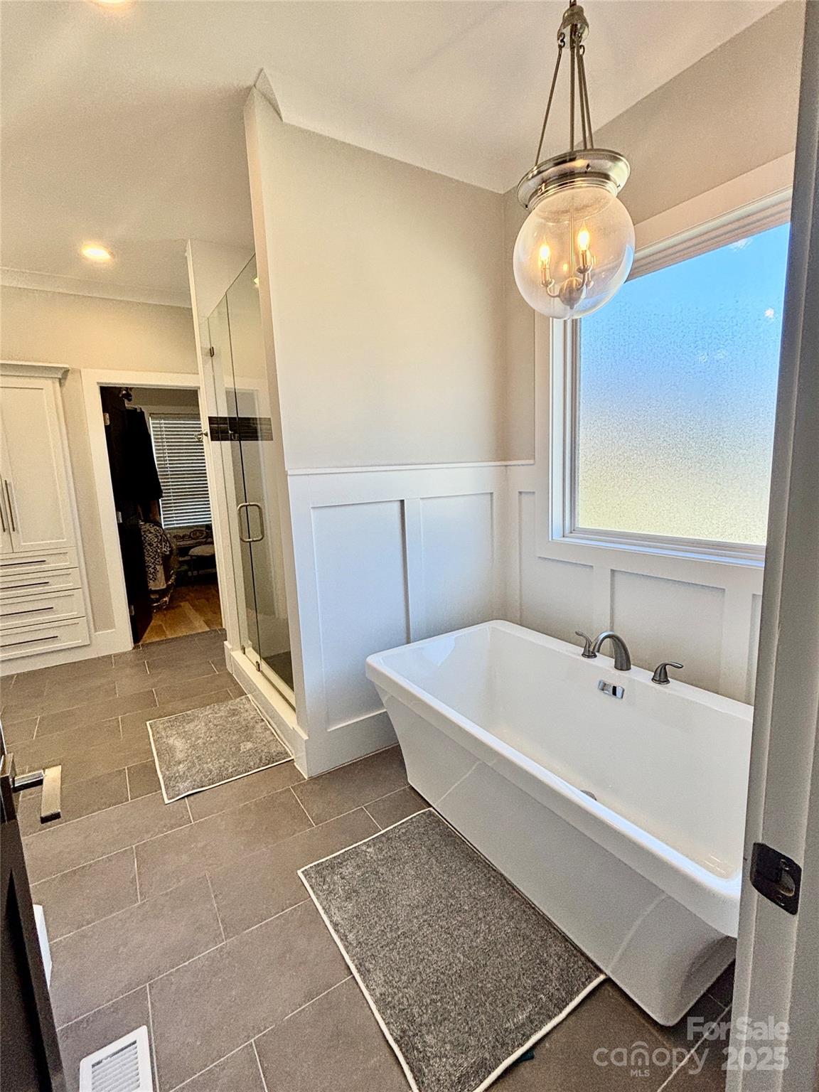 108 41st Avenue Northwest Hickory, NC 28601 - Photo 22 of 48 a white bath tub sitting in a bathroom