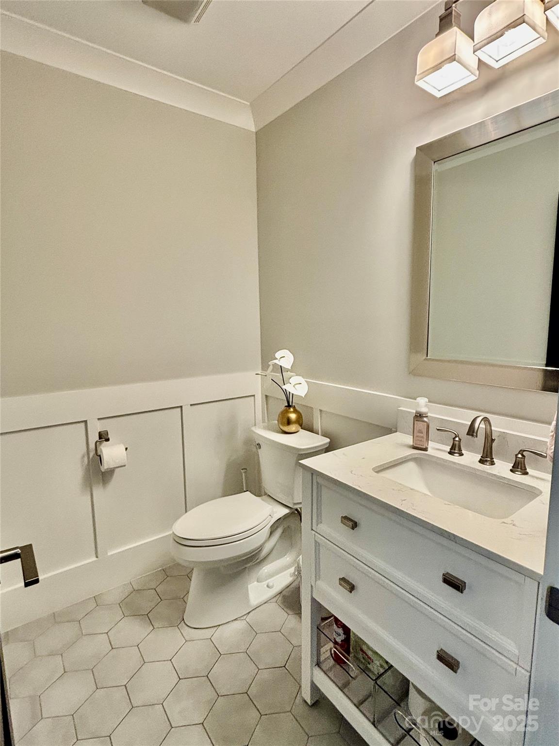 108 41st Avenue Northwest Hickory, NC 28601 - Photo 27 of 48 a bathroom with a granite countertop sink a toilet and a mirror