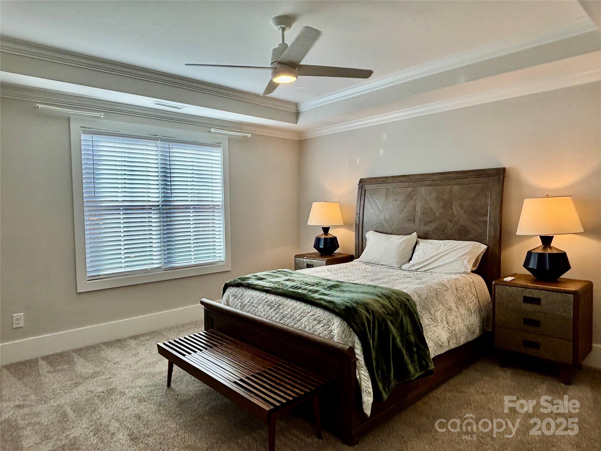 108 41st Avenue Northwest Hickory, NC 28601 - Photo 37 of 48 a bedroom with a bed two lamps and a large window