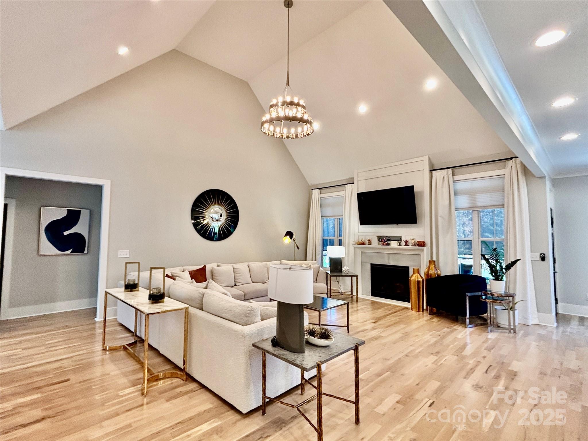 108 41st Avenue Northwest Hickory, NC 28601 - Photo 5 of 48 a living room with furniture a fireplace and a flat screen tv
